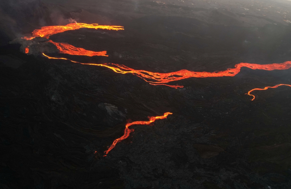 An aerial view of the lava from the Cumbre Vieja volcano near Tacande neighborhood, on the Canary Island of La Palma, Spain, December 13, 2021. Picture taken with a drone. REUTERS/Borja Suarez