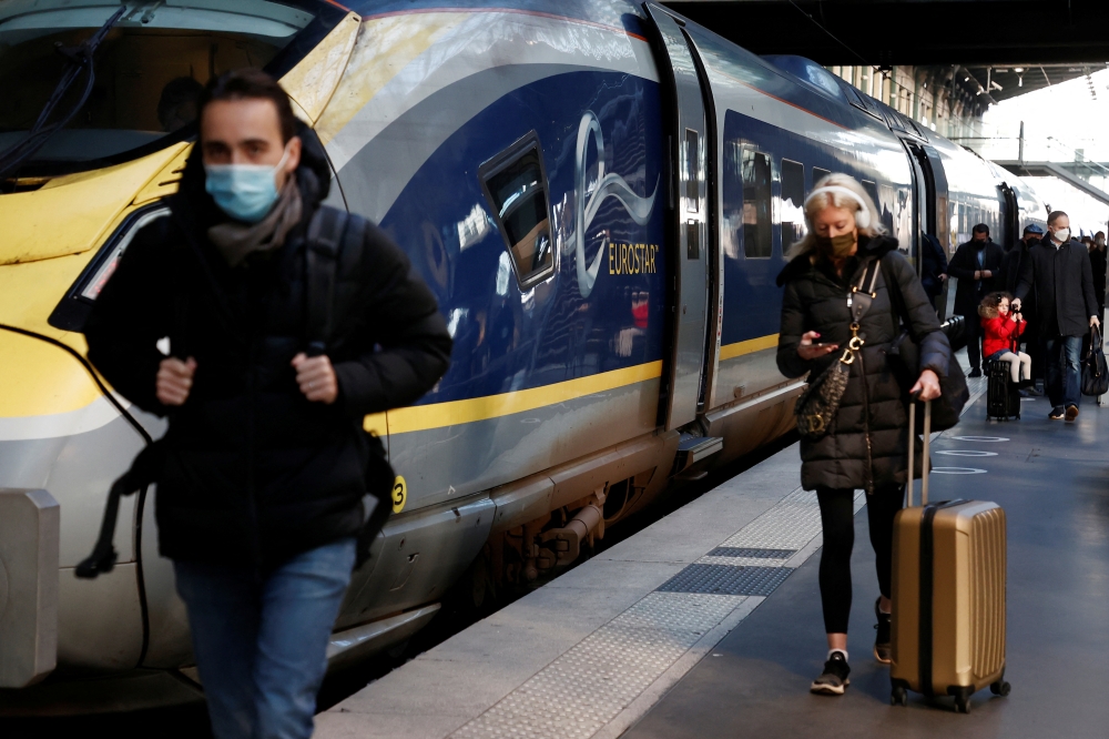 Passengers arrive at the Eurostar terminal at Gare du Nord train station, after France eased travel restrictions for travellers from Britain amid the spread of the coronavirus disease (COVID-19) pandemic, in Paris, France, January 14, 2022. REUTERS/Noemie Olive