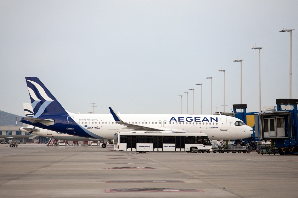 An Aegean Airlines Airbus A320neo is docked at a plane jetway of the Eleftherios Venizelos International Airport, in Athens, Greece, May 11, 2020. Reuters/Alkis Konstantinidis/File Photo