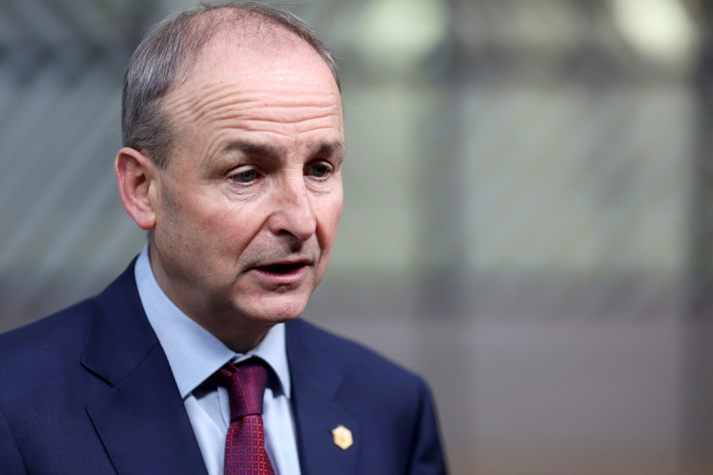 Ireland's Prime Minister (Taoiseach) Micheal Martin looks on as he arrives to attend an European Union Summit at the European Council building in Brussels, Belgium December 16, 2021. Kenzo Tribouillard/Pool via REUTERS/File Photo
