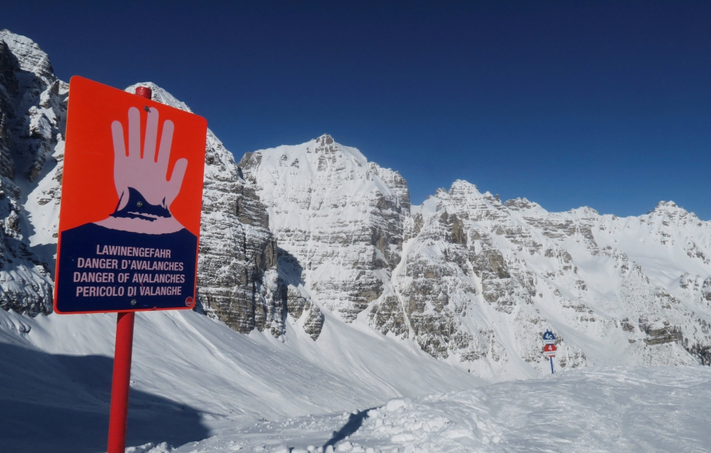 FILE PHOTO: An avalanche warning sign is seen next to the slope at Schlick 2000 ski resort near Neustift im Stubaital, Austria February 6 2020. REUTERS/Leonhard Foeger