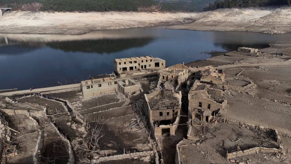 A general view shows the ancient village of Aceredo that had been submerged by Limia river in the 1990s after the dam was built in Concello de Lobios, Spain, February 10, 2022. Picture taken with a drone. REUTERS/Miguel Vidal