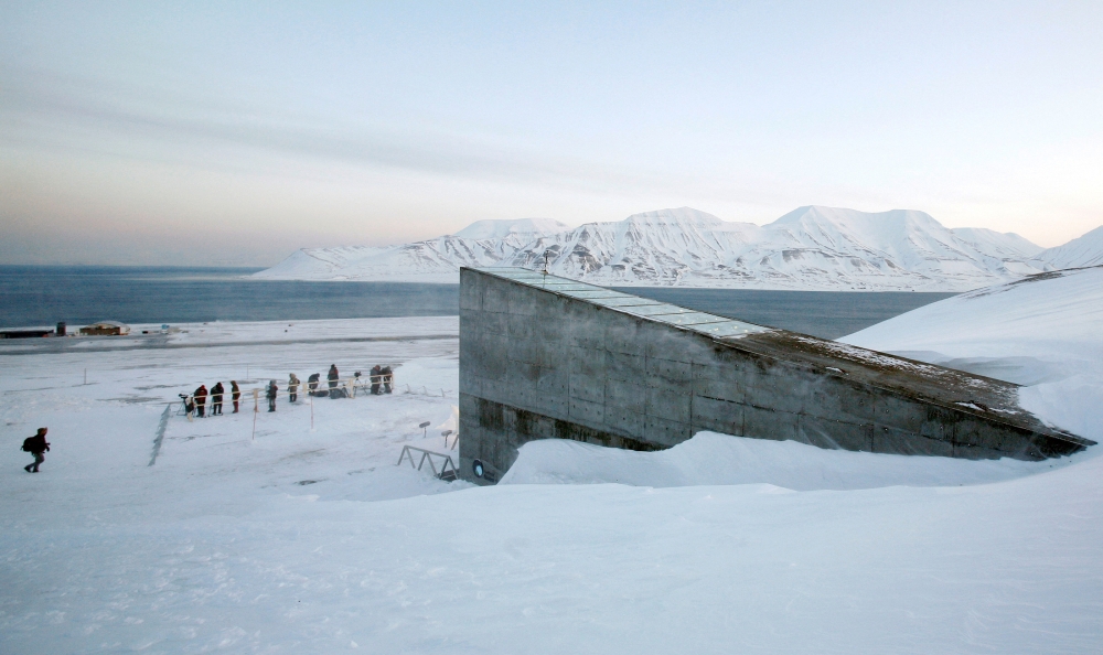 File photo: Television crews stand outside the Global Seed Vault before the opening ceremony in Longyearbyen, February 26, 2008. Reuters/Bob Strong 