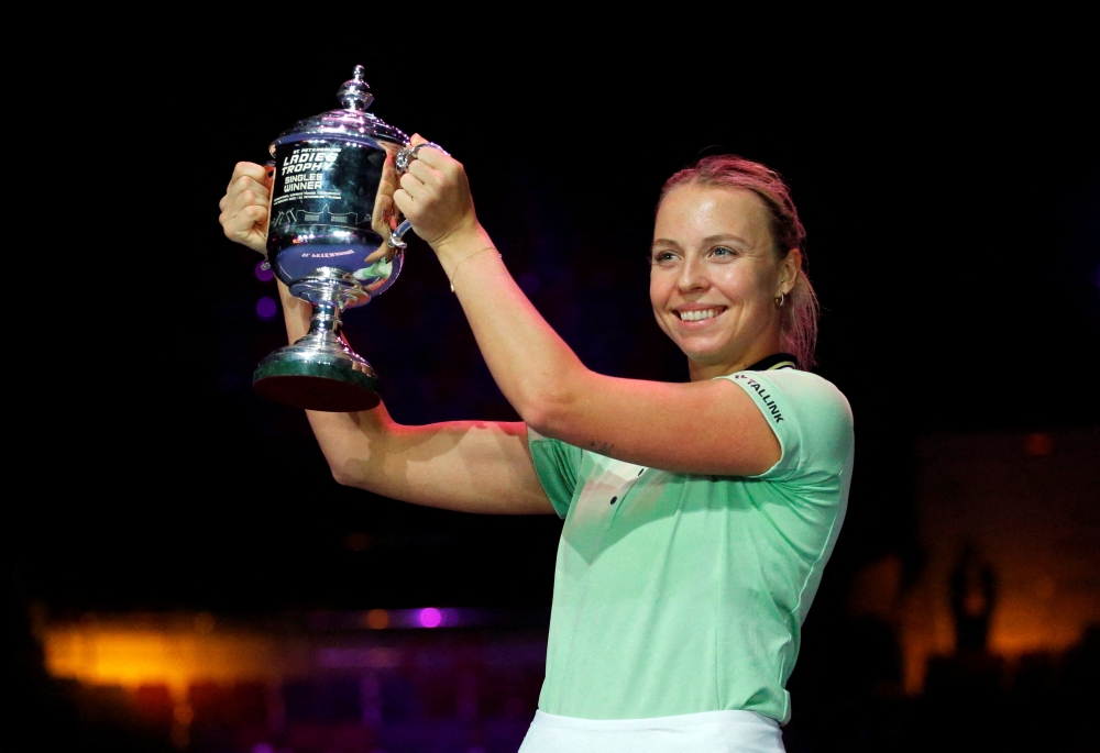 February 13, 2022 Estonia's Anett Kontaveit celebrates with the trophy after winning the final against Greece's Maria Sakkari REUTERS/Anton Vaganov/File Photo