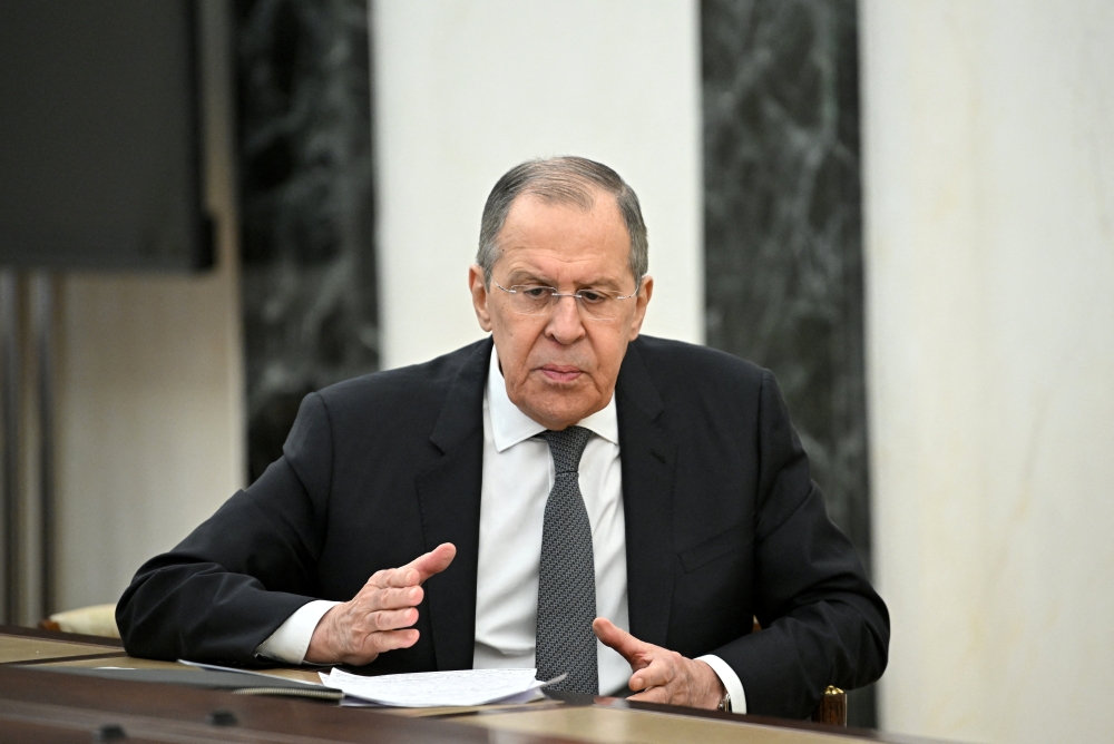 Russian Foreign Minister Sergei Lavrov attends a meeting with Russian President Vladimir Putin in Moscow, Russia February 14, 2022. Sputnik/Aleksey Nikolskyi/Kremlin via Reuters