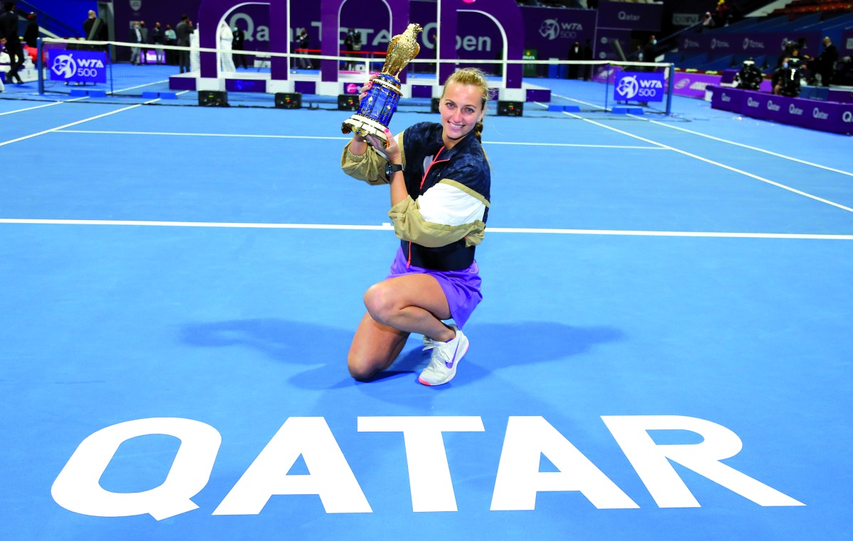 Petra Kvitova lifts the trophy after winning Qatar TotalEnergies Open 2021, in this file photo. 