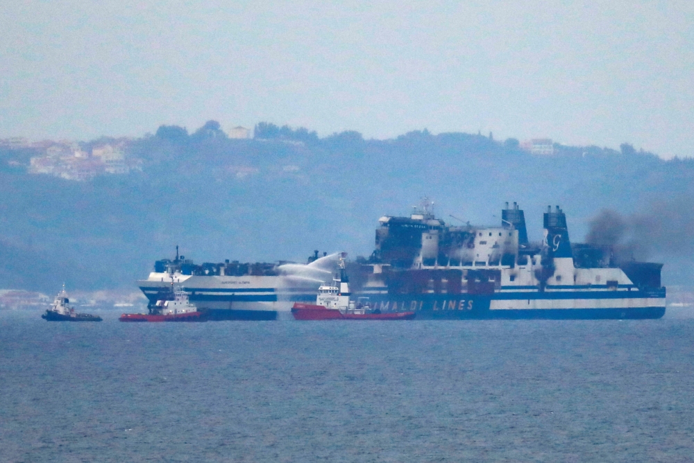 Smoke on the Italian-flagged Euroferry Olympia, which sailed from Greece to Italy early on Friday and caught fire, is seen from Sarande, Albania, February 20, 2022. REUTERS/Florion Goga