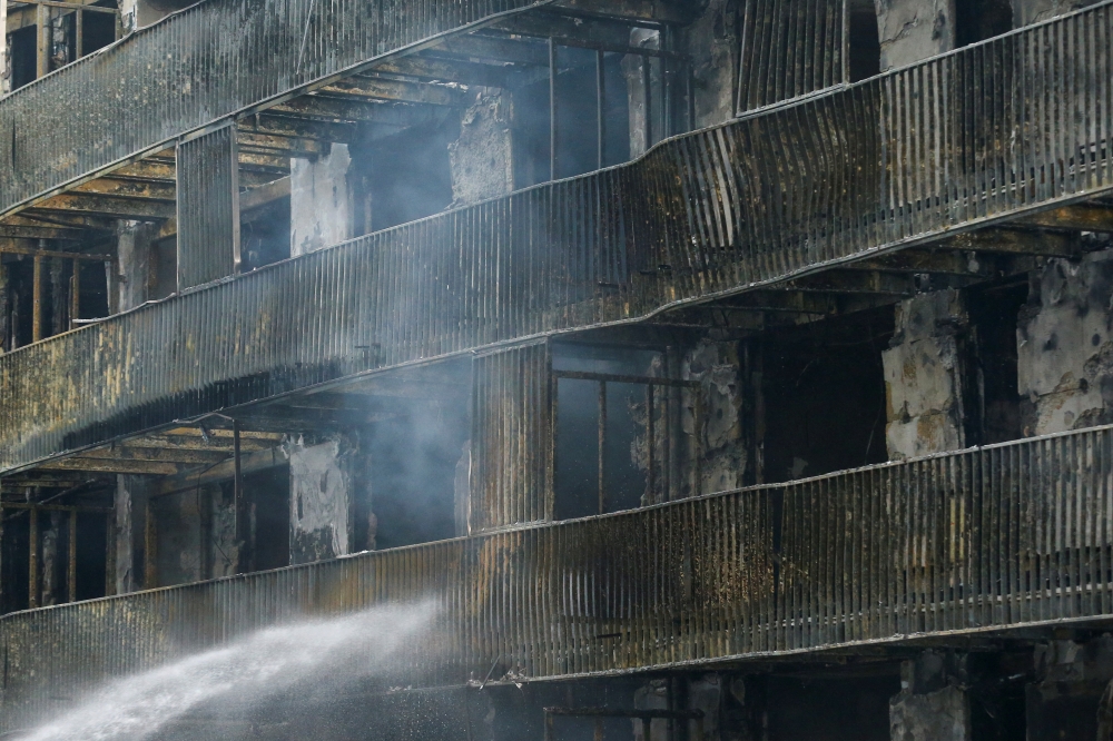 The damage at an apartment block that caught fire is seen, in Essen, Germany February 21, 2022. REUTERS/Thilo Schmuelgen