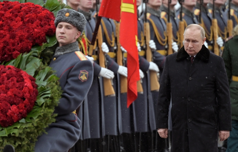 Russian President Vladimir Putin takes part in a wreath laying ceremony at the Tomb of the Unknown Soldier by the Kremlin Wall on the Defender of the Fatherland Day in Moscow, Russia February 23, 2022. Sputnik/Aleksey Nikolskyi/Kremlin via Reuters