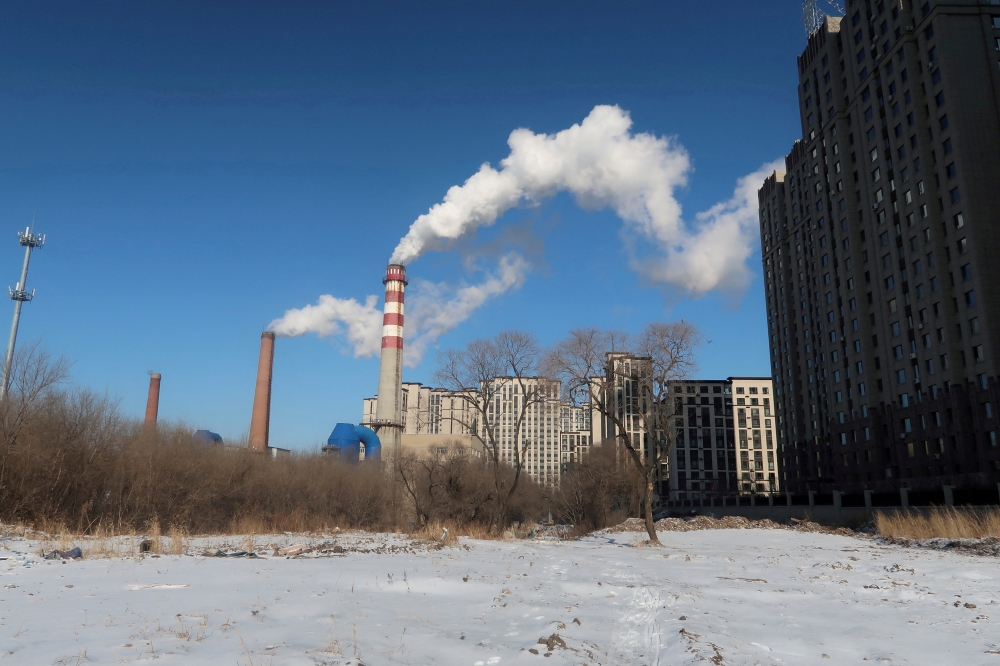 File photo: A coal-fired heating complex is seen behind the ground covered by snow in Harbin, Heilongjiang province, China November 15, 2019. Reuters/Muyu Xu/File Photo