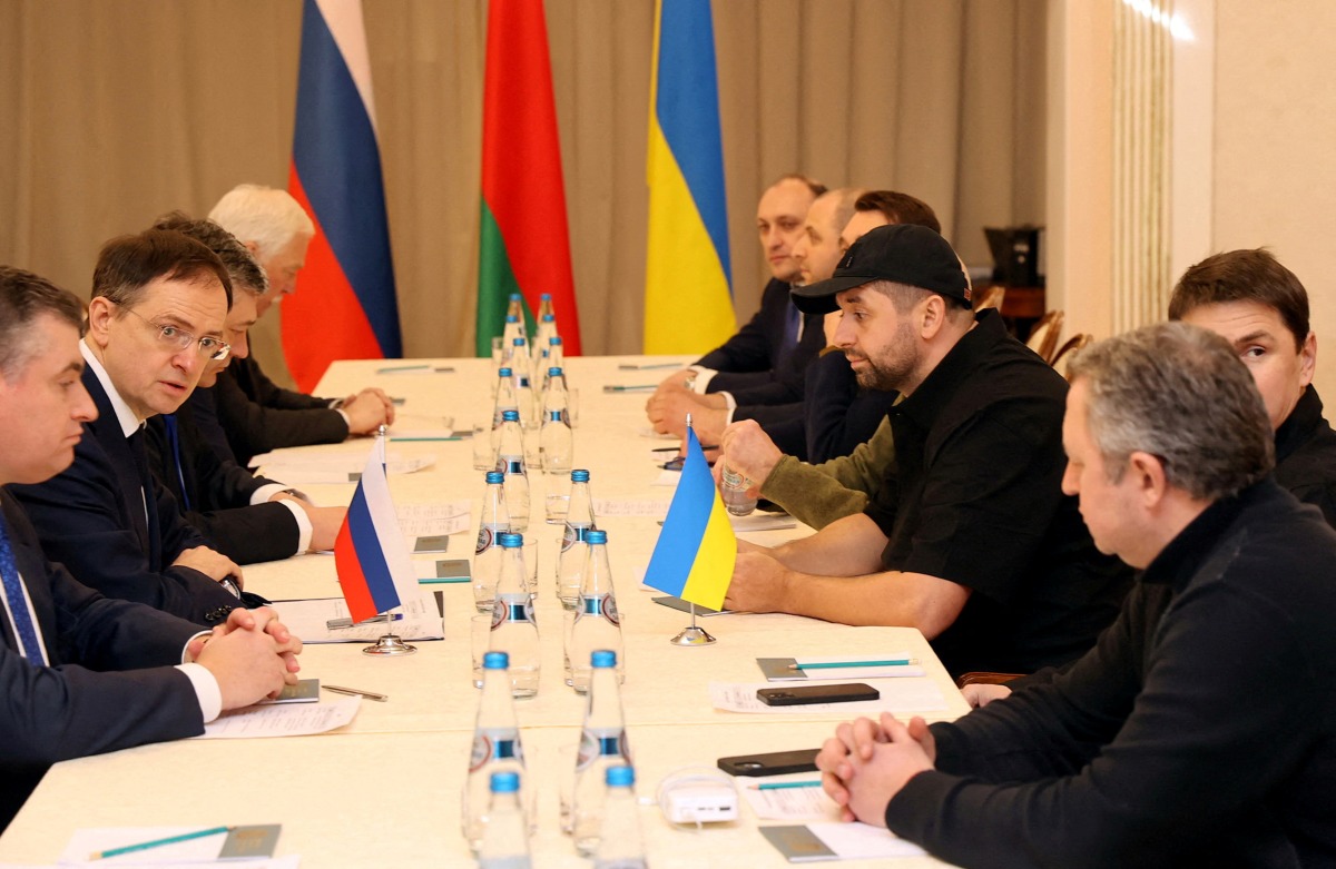 FILE PHOTO: Russian and Ukrainian officials take part in the talks in the Gomel region, Belarus February 28, 2022. Sergei Kholodilin/BelTA/Handout via REUTERS 