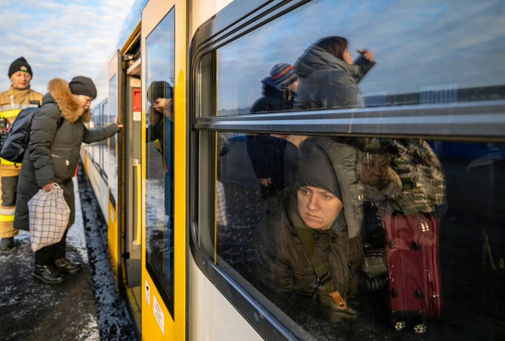 People fleeing Russia's invasion of Ukraine change trains at Euroterminal to be transferred to temporary accommodation centres around the country, in Slawkow, Poland March 5, 2022. Grzegorz Celejewski/Agencja Wyborcza