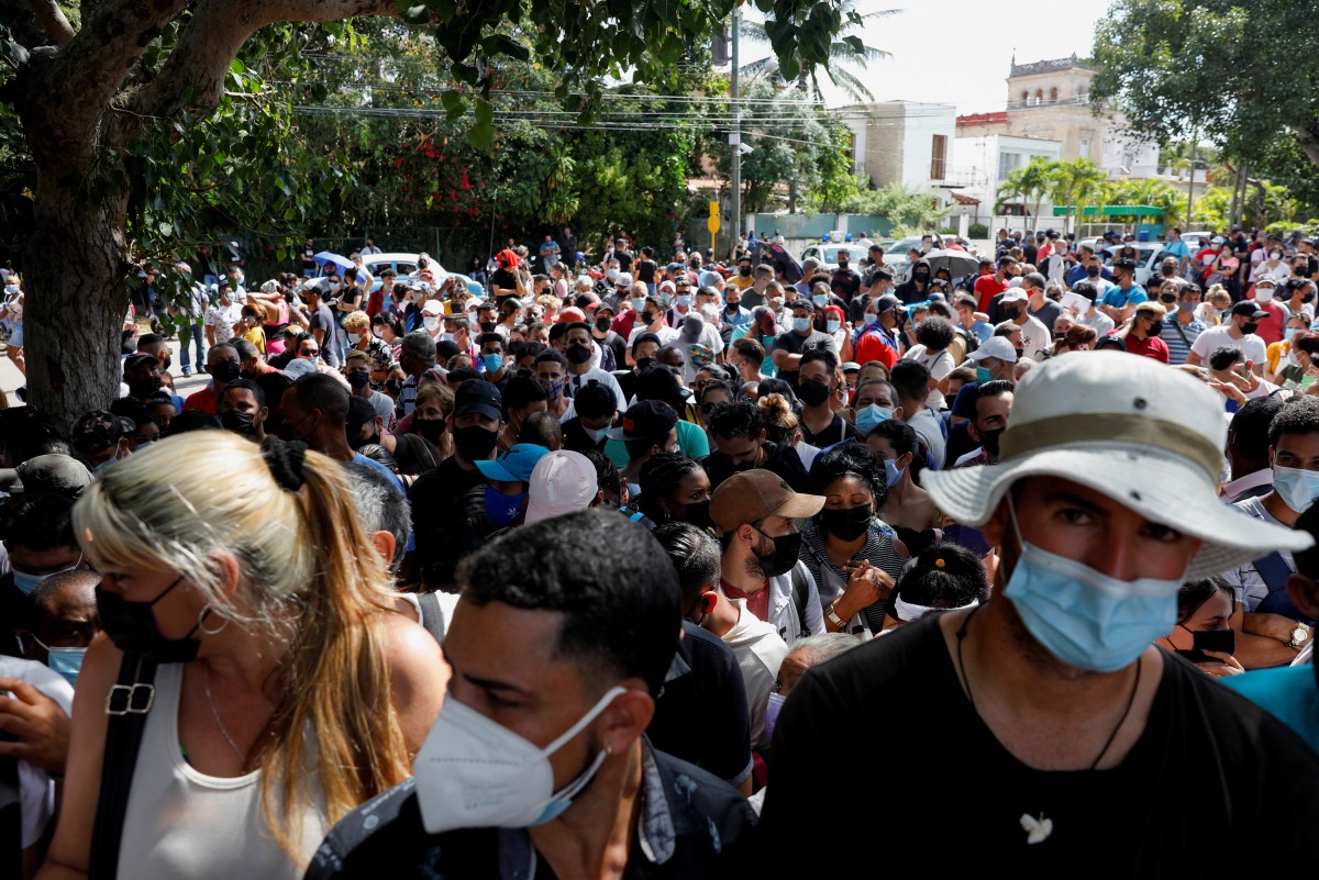 People gather outside Panama Embassy after the country tightened visa requirements, in Havana, Cuba, March 9, 2022. REUTERS/Amanda Perobelli
