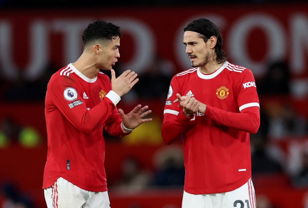 January 22, 2022 Manchester United's Cristiano Ronaldo and Edinson Cavani REUTERS/Phil Noble 