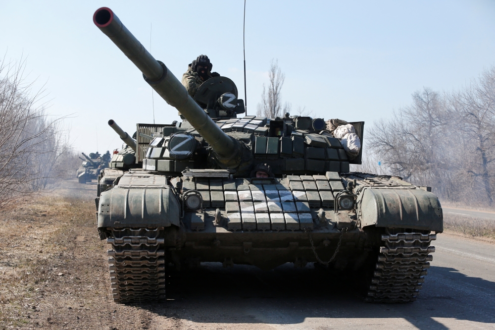 A view shows a convoy of pro-Russian troops during Ukraine-Russia conflict outside the separatist-controlled town of Volnovakha in the Donetsk region, Ukraine March 12, 2022. REUTERS.