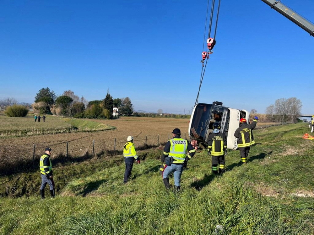 Firefighters work at the scene of an accident where a bus crashed while carrying Ukrainian citizens, near Cesena, Italy, March 13, 2022. Polizia di Stato/Handout via REUTERS
