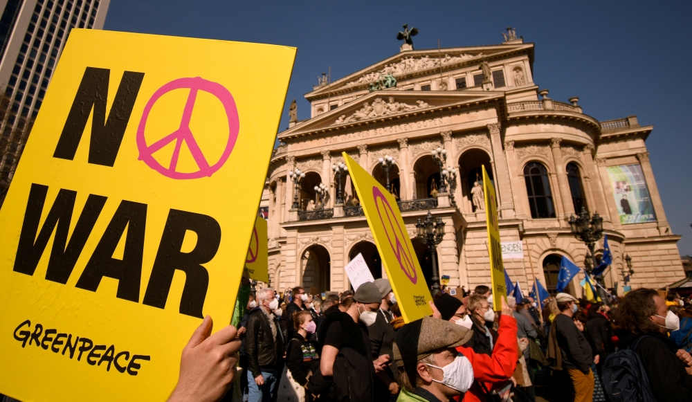 A demonstrator holds a 
