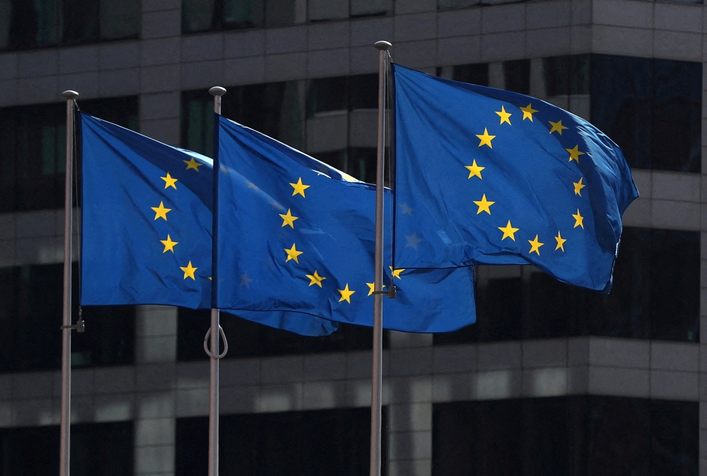 FILE PHOTO: European Union flags fly outside the European Commission headquarters in Brussels, Belgium, April 10, 2019. REUTERS/Yves Herman
