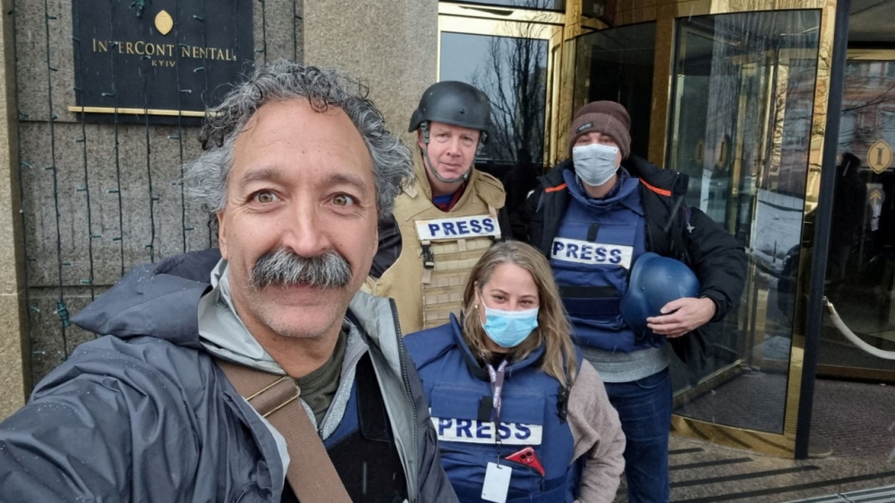 Fox News cameraman Pierre Zakrzewski, who was killed in Ukraine after the vehicle in which he was traveling was struck by incoming fire, poses for a selfie with colleagues Steve Harrigan, Yonat Frilling and Ibrahim Hazboun in Kyiv, Ukraine in an undated photograph. FOX News Sunday/Handout via REUTERS.