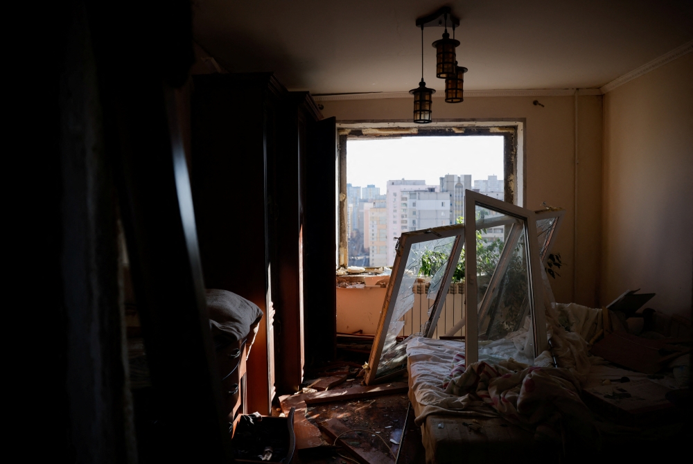 A view of a bedroom in a damaged apartment after an intercepted missile hit a residential building in Kyiv, Ukraine March 17, 2022. REUTERS.
