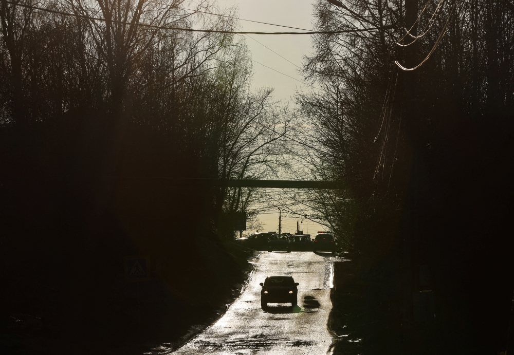 A car drives along a road in the town of Pokrov in Vladimir Region, Russia March 21, 2022. Picture taken March 21, 2022. REUTERS/Evgenia Novozhenina