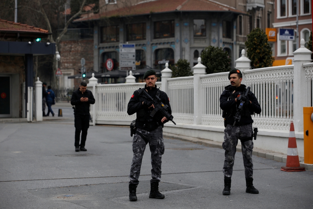 Members of the Turkish Presidential security team stand guard outside the Dolmabahce Presidential Working Office during the face-to-face talks between Ukrainian and Russian negotiators, in Istanbul, Turkey March 29, 2022. Reuters/Dilara Senkaya