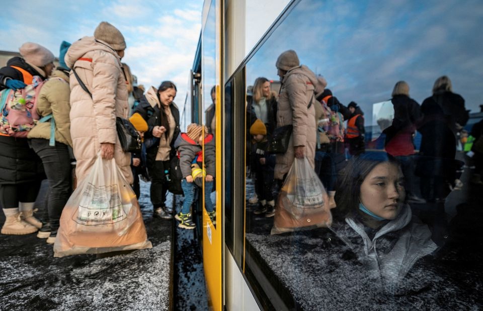 People fleeing Russian invasion of Ukraine change trains at Euroterminal to be transferred to temporary accommodation centers around the country, in Slawkow, Poland March 5, 2022. Grzegorz Celejewski/Agencja Wyborcza.pl via REUTERS/File Photo

