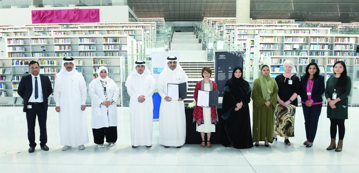 HMC’s Deputy Chief Quality Officer and Director of Hamad Healthcare Quality Institute Nasser Al Naimi and Executive Director at QNL Tan Huism, with other officials after signing the MoU.