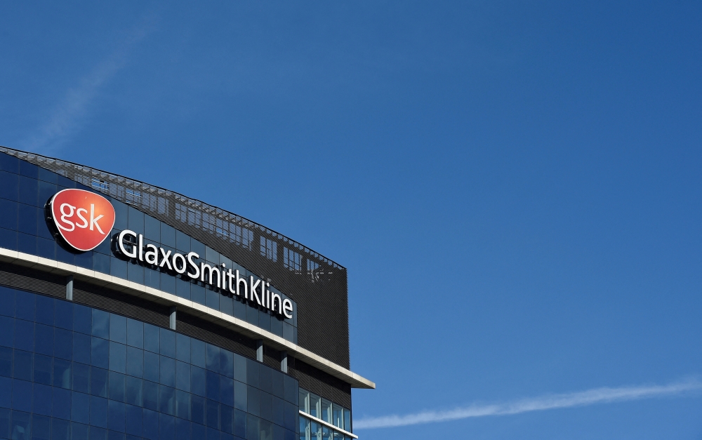 Signage for GlaxoSmithKline is seen on it's offices in London, Britain, March 30, 2016. REUTERS/Toby Melville/File Photo