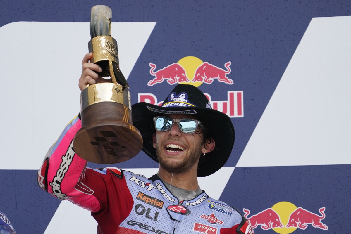 Enea Bastianini of Italy (23) celebrates on the podium after winning the MotoGP race at the Red Bull Grand Prix of the Americas MotoGP at Circuit of the Americas. Mandatory Credit: Chuck Burton-USA TODAY Sports
