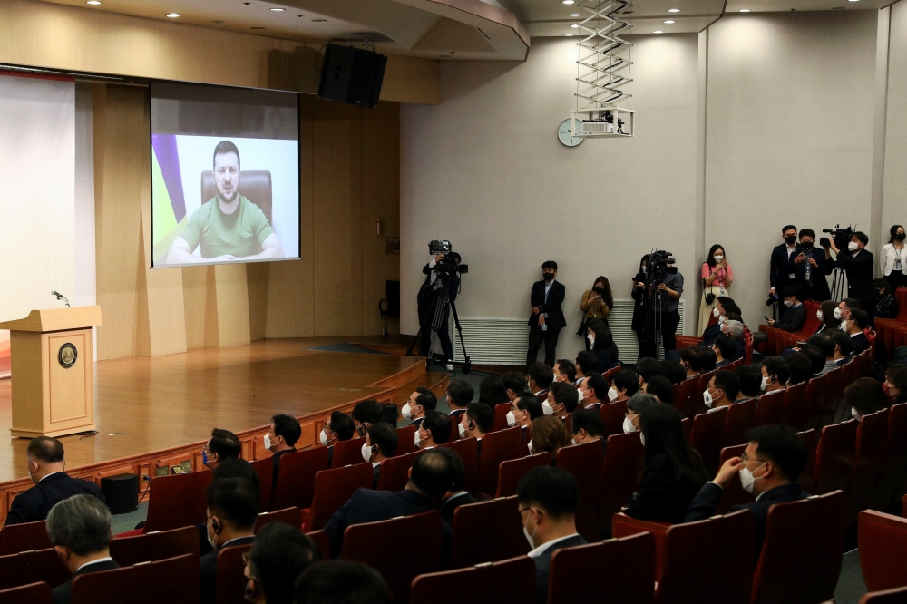 Ukrainian President Volodymyr Zelenskiy addresses South Korean parliament via video link at National Assembly in Seoul, South Korea April 11, 2022. Chung Sung-Jun/Pool via Reuters 