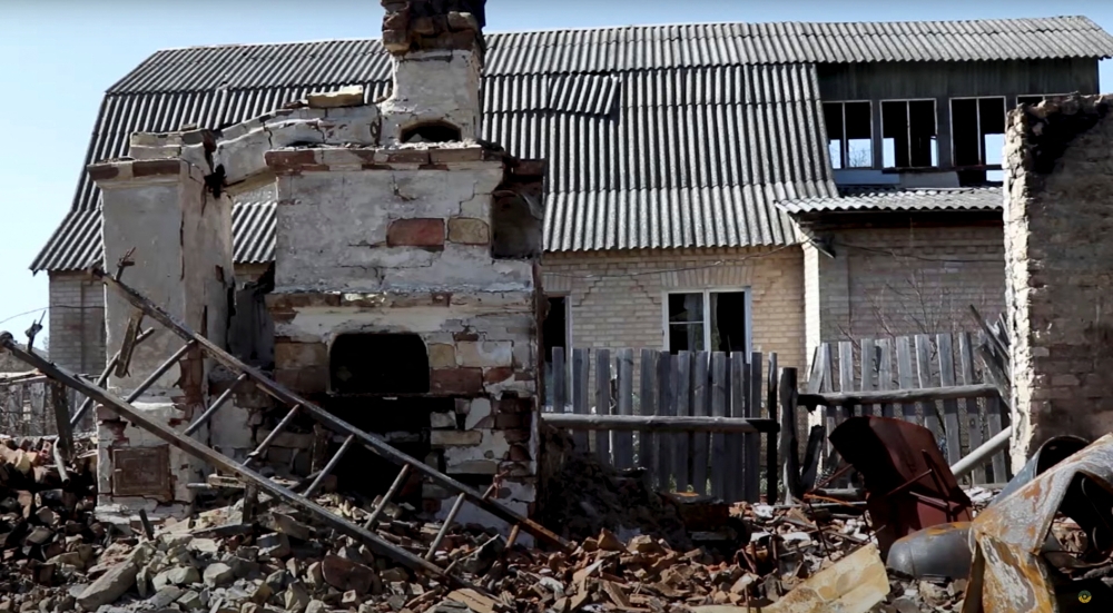 A view shows debris next to a damaged building, amid Russia's invasion, in Moshchun village, Kyiv region, Ukraine in this still image taken from a video released April 22, 2022. Ukrainian military TV/Handout via REUTERS