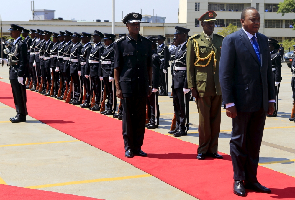 Kenya's President Uhuru Kenyatta (R) inspects a guard of honor outside the parliament building in Uganda's capital Kampala, August 10, 2015, before addressing legislators as part of his three-day state visit. REUTERS/James Akena/File Photo
 