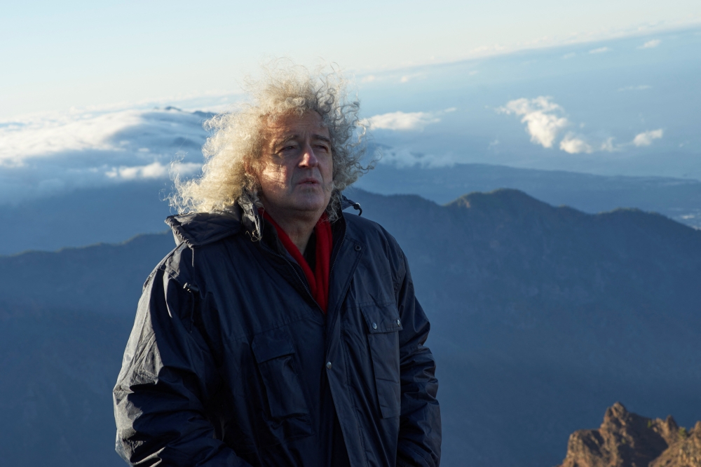 Musician Brian May looks on while shooting a music video on the island of La Palma, Spain in this undated handout image. Richard Gray/Duck Productions/Handout via REUTERS
