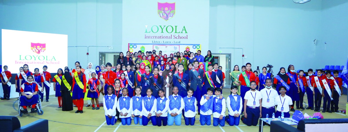 Staff and students during Investiture Ceremony at Loyola International School.