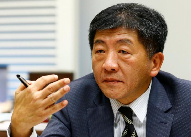 FILE PHOTO : Chen Shih-chung Taiwan's Minister of Health and Welfare gestures during an interview with Reuters ahead of the World Health Assembly of the World Health Organization (WHO) in Geneva, Switzerland May 20, 2017. REUTERS/Denis Balibouse
