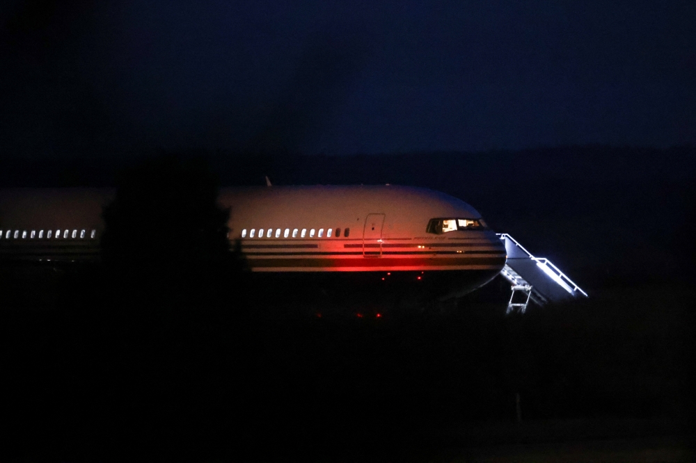 A plane reported by British media to be first to transport migrants to Rwanda is seen at MOD Boscombe Down base in Wiltshire, Britain, June 14, 2022. Reuters/Hannah McKay
