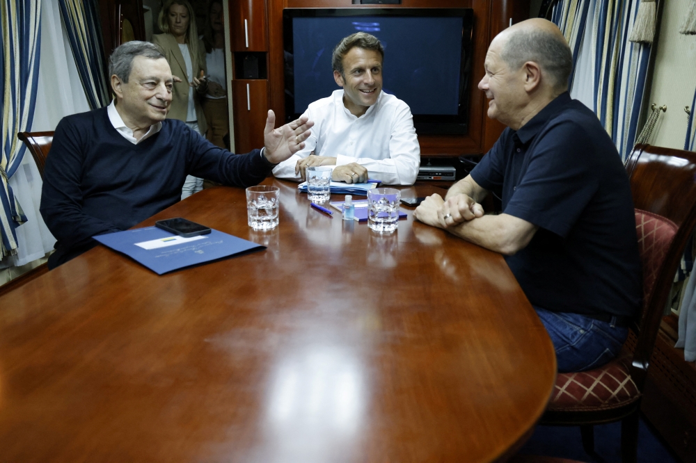 French President Emmanuel Macron, German Chancellor Olaf Scholz and Italian Prime Minister Mario Draghi travel on board a train bound to Kyiv after departing from Poland, June 16, 2022. Ludovic Marin/Pool via Reuters