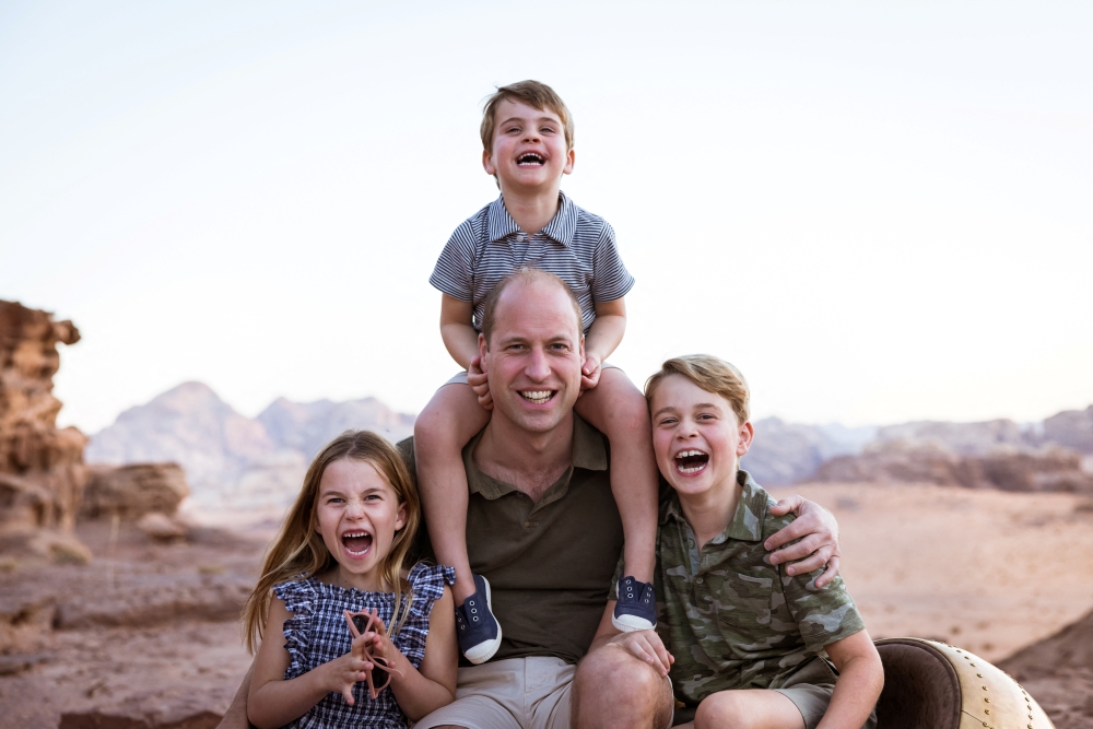 A handout photo of Britain's Prince William with Princess Charlotte, Prince Louis and Prince George taken in Jordan in the Autumn of 2021. Reuters