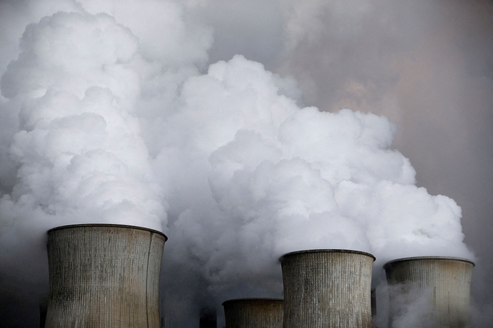 Steam rises from the cooling towers of the coal power plant of RWE, one of Europe's biggest electricity and gas companies in Niederaussem, Germany. Reuters/Wolfgang Rattay/File Photo