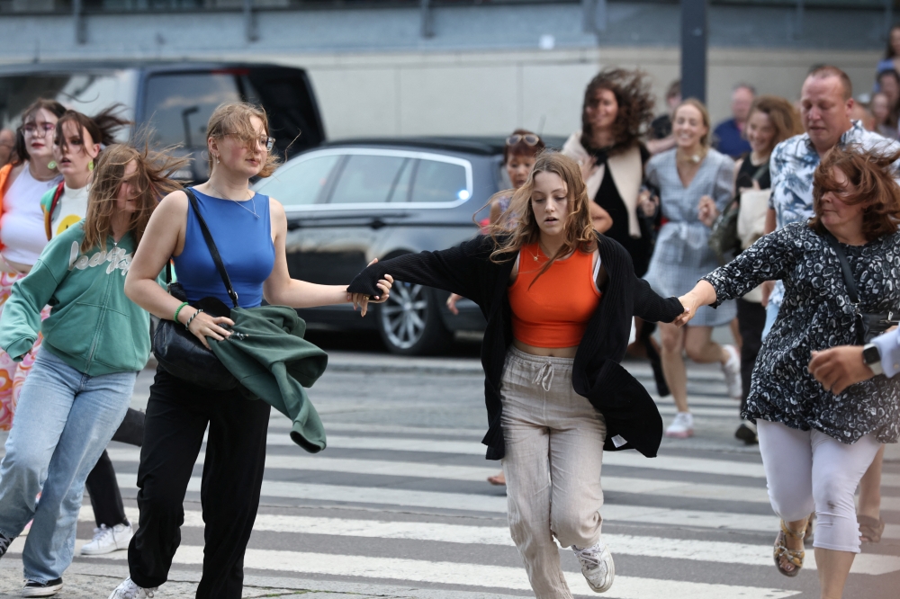 People leave Field's shopping centre, after Danish police said they received reports of shooting, in Copenhagen, Denmark, July 3, 2022. Ritzau Scanpix/Olafur Steinar Gestsson