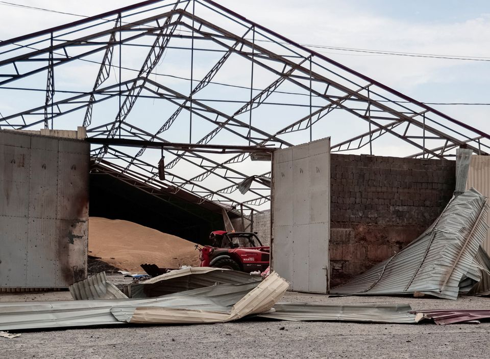 Seeds are seen in a grain silo destroyed after it was shelled repeatedly, amid Russia's invasion of Ukraine, in Donetsk region, Ukraine May 31, 2022. REUTERS/Serhii Nuzhnenko/File Photo

