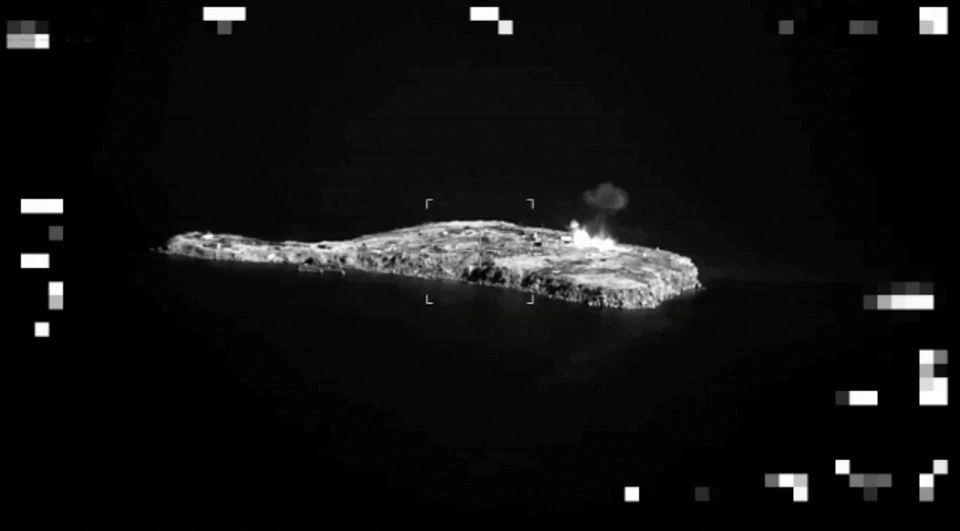 Surveillance shows an aircraft flying past and dropping explosives, amid Russia's invasion of Ukraine, in a location given as Zmiinyi (Snake) Island, Ukraine, in this screen grab taken from a video released July 1, 2022. Chief of Ukraine's General Staff Valeriy Zaluzhny via Telegram/ Handout via REUTERS.