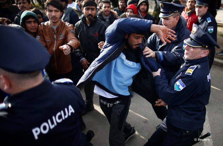 FILE PHOTO: A migrant is detained for trying to block a road in front of the refugee camp Miral in Velika Kladusa, Bosnia and Herzegovina February 15, 2020. Reuters /Dado Ruvic