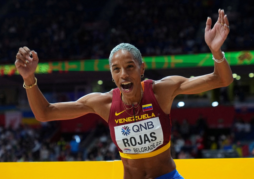 Venezuela's Yulimar Rojas celebrates winning gold and setting a new world record in the women's triple jump final during the World Athletics Indoor Championships at Stark Arena, Belgrade, Serbia, on March 20, 2022. (Reuters/Aleksandra Szmigiel)