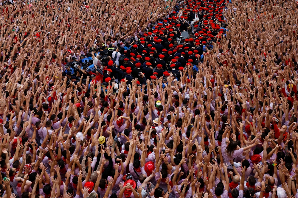 Revellers gather for the opening of the San Fermin festival (Chupinazo) in Pamplona, Spain, July 6, 2022. (Reuters/Vincent West)