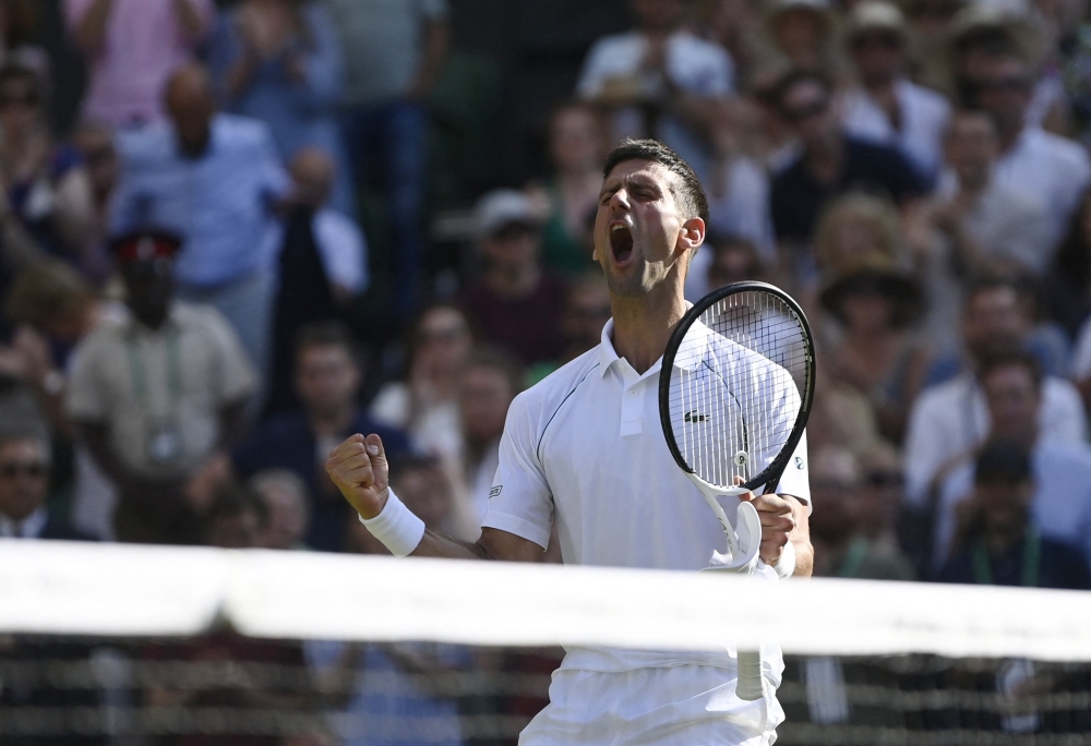 Serbia's Novak Djokovic celebrates winning his semi-final match against Britain's Cameron Norrie. (Reuters/Toby Melville)

