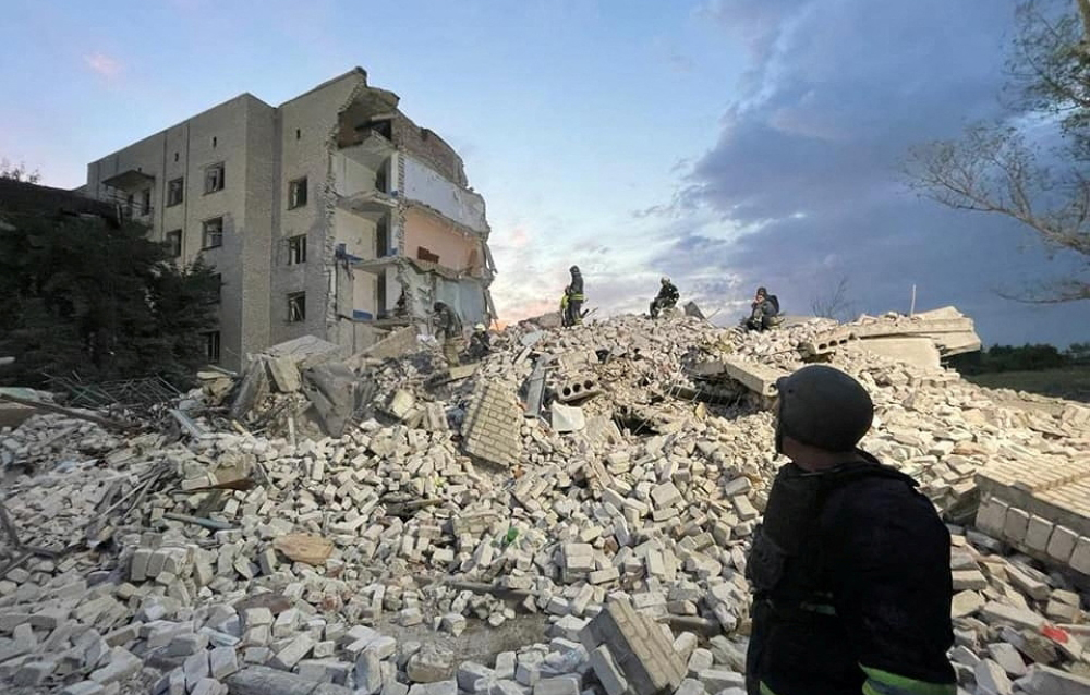 Rescue operation is underway after a missile strike, amid Russia's invasion of Ukraine, at a location given as Chasiv Yar, Ukraine, in this handout image released July 10, 2022. Donetsk region governor Pavlo Kyrylenko