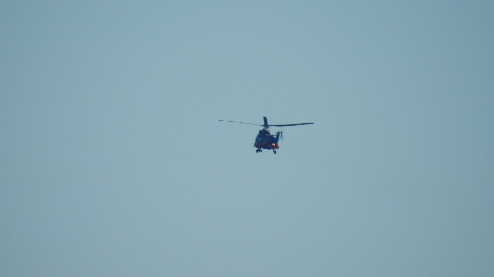 A Hellenic Air Force helicopter departs Chios Airport en route to Greek island Samos for a search and rescue mission after a helicopter fighting a forest fire crashed in the sea, Greece in this picture obtained from social media July 13, 2022. Twitter @AegeanHawk/via REUTERS THIS IMAGE HAS BEEN SUPPLIED BY A THIRD PARTY. MANDATORY CREDIT. NO RESALES. NO ARCHIVES.