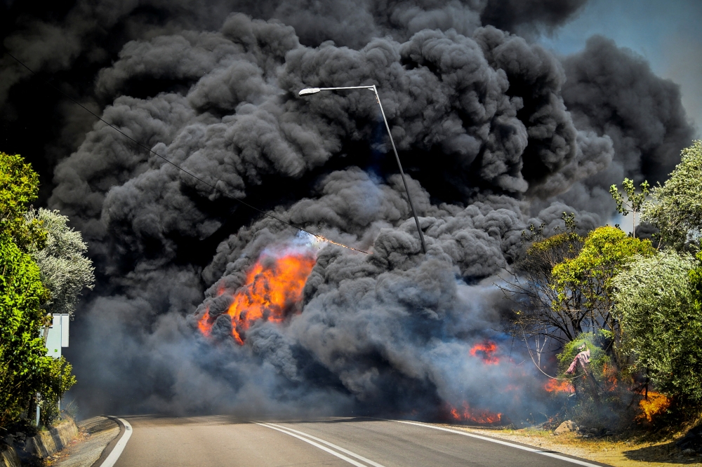 A wildfire burns at the village of Krestena, in the western Peloponnese, Greece, July 24, 2022. (Giannis Spirounis/Eurokinissi via REUTERS)

